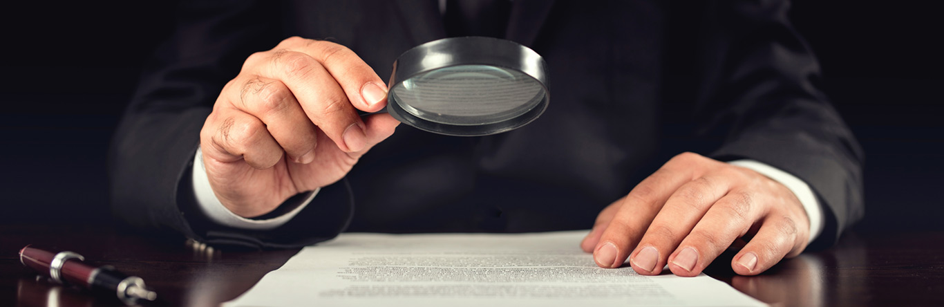 Title Examiner with magnifying glass